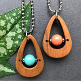 Two smooth wood necklaces with colorful Swarovski beads
