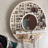 Mirror and earring storage in use with dangle earrings, stud earrings and necklaces.